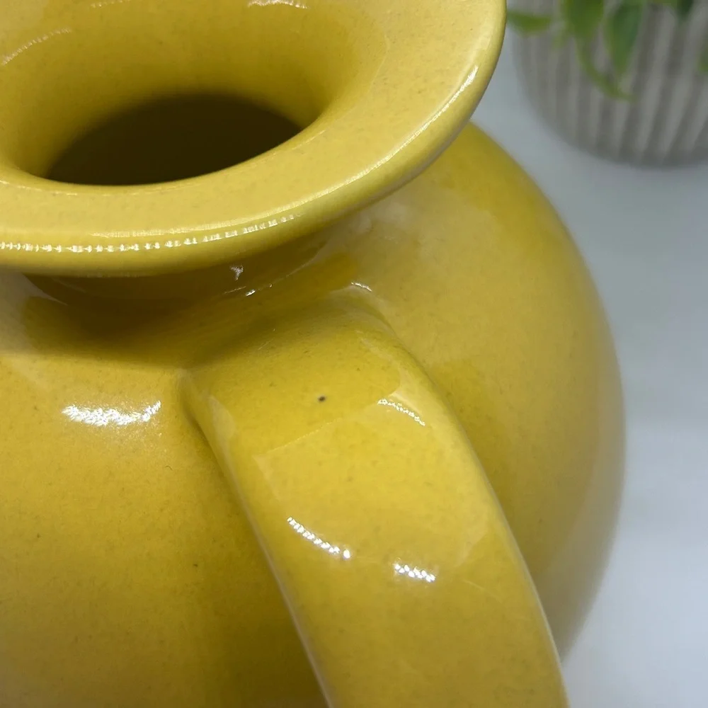 Frankoma Pottery Yellow MCM #82 Carafe dating back to the 1950s.
